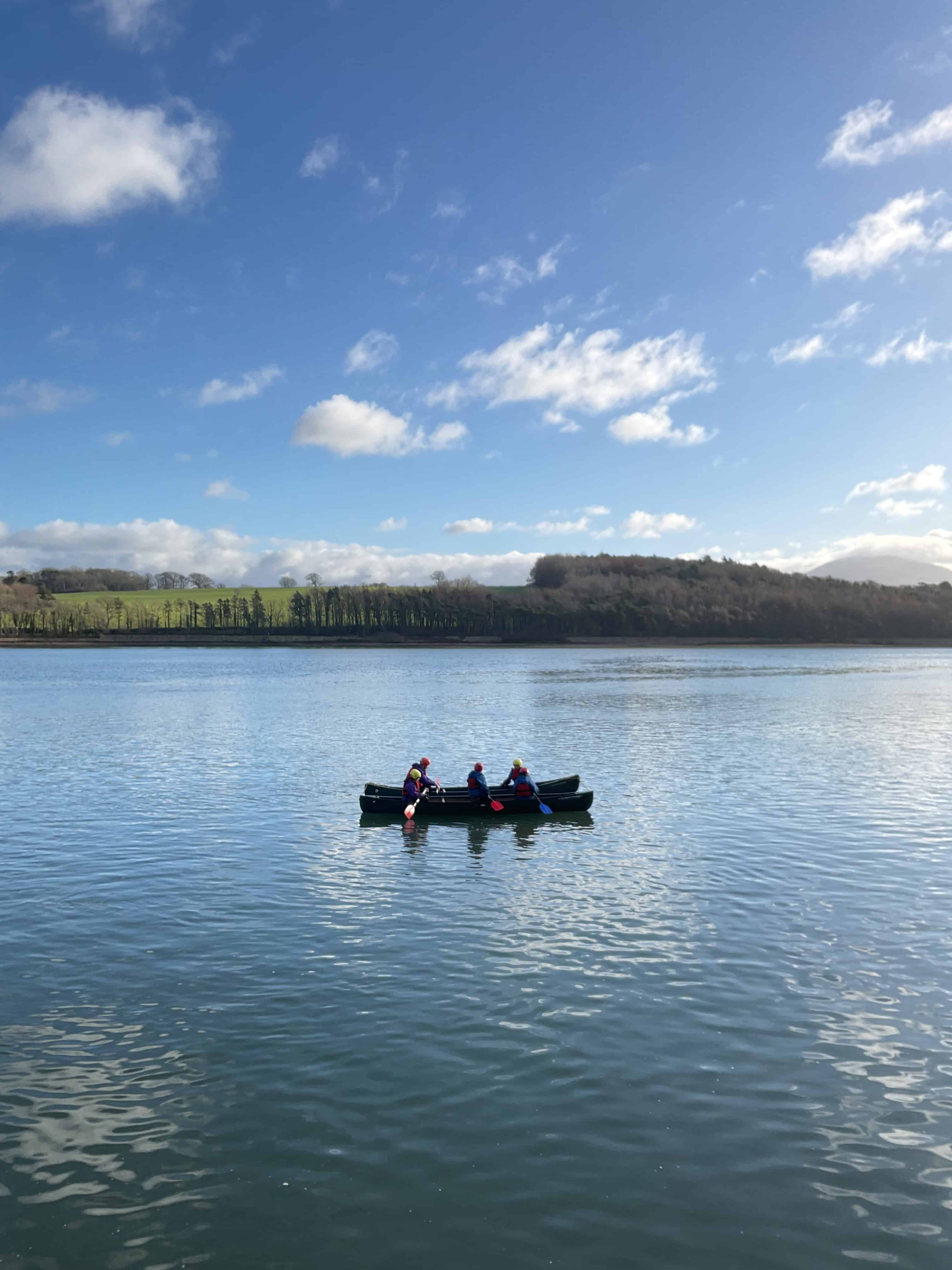 Students from Priestnall School navigate a canoe on Menai Strait during their visit to the Conway Centre in Anglesey.