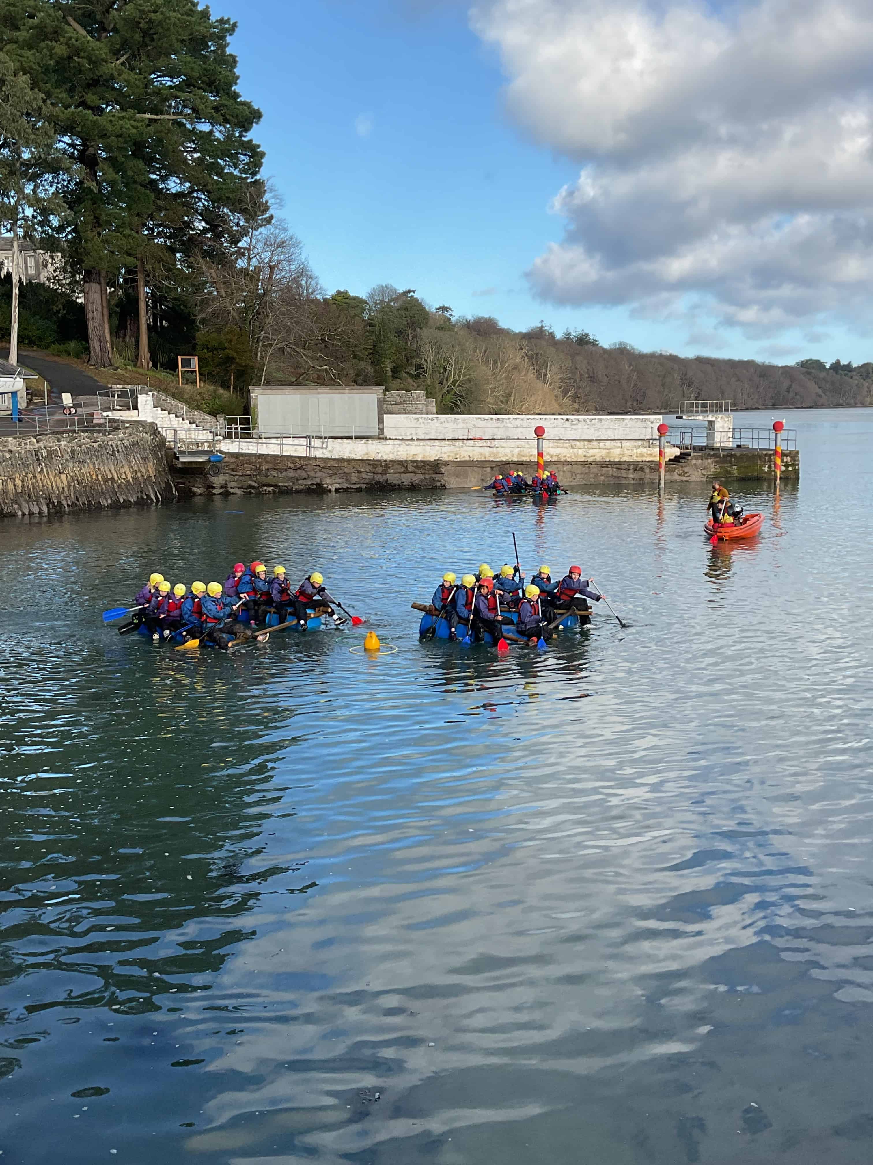Groups of students from Priestnall School sail on Menai Strait on rafts they have built during a trip at the Conway Centre in Anglesey.
