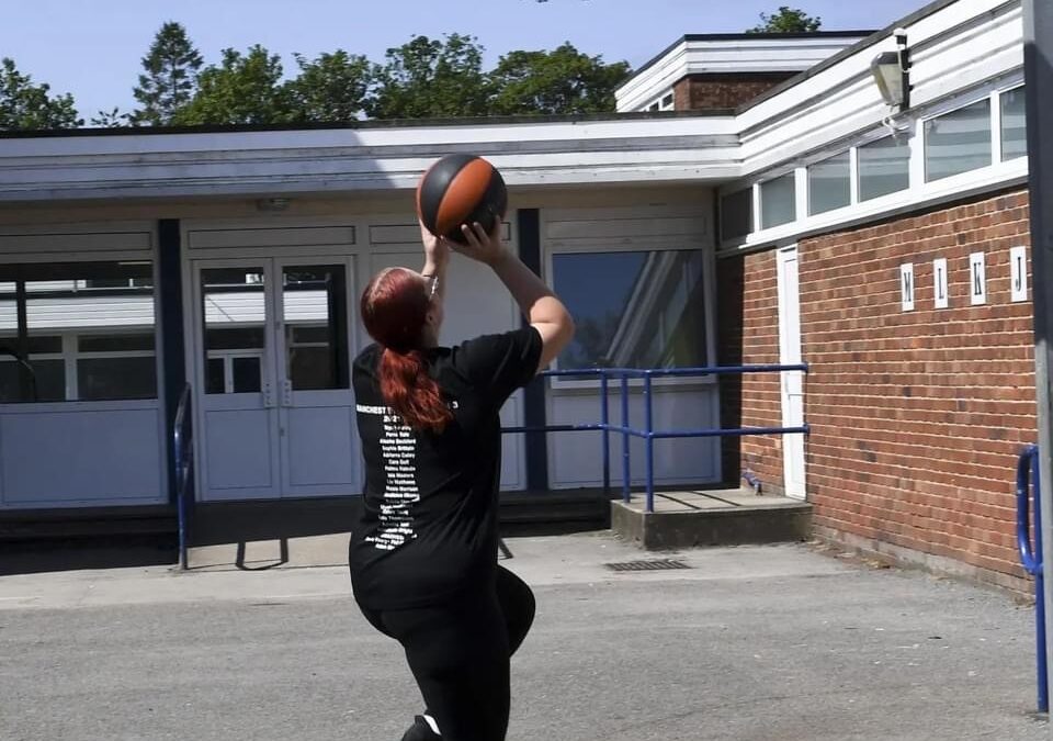 Image of Priestnall School student shooting a hoop in Basketball.
