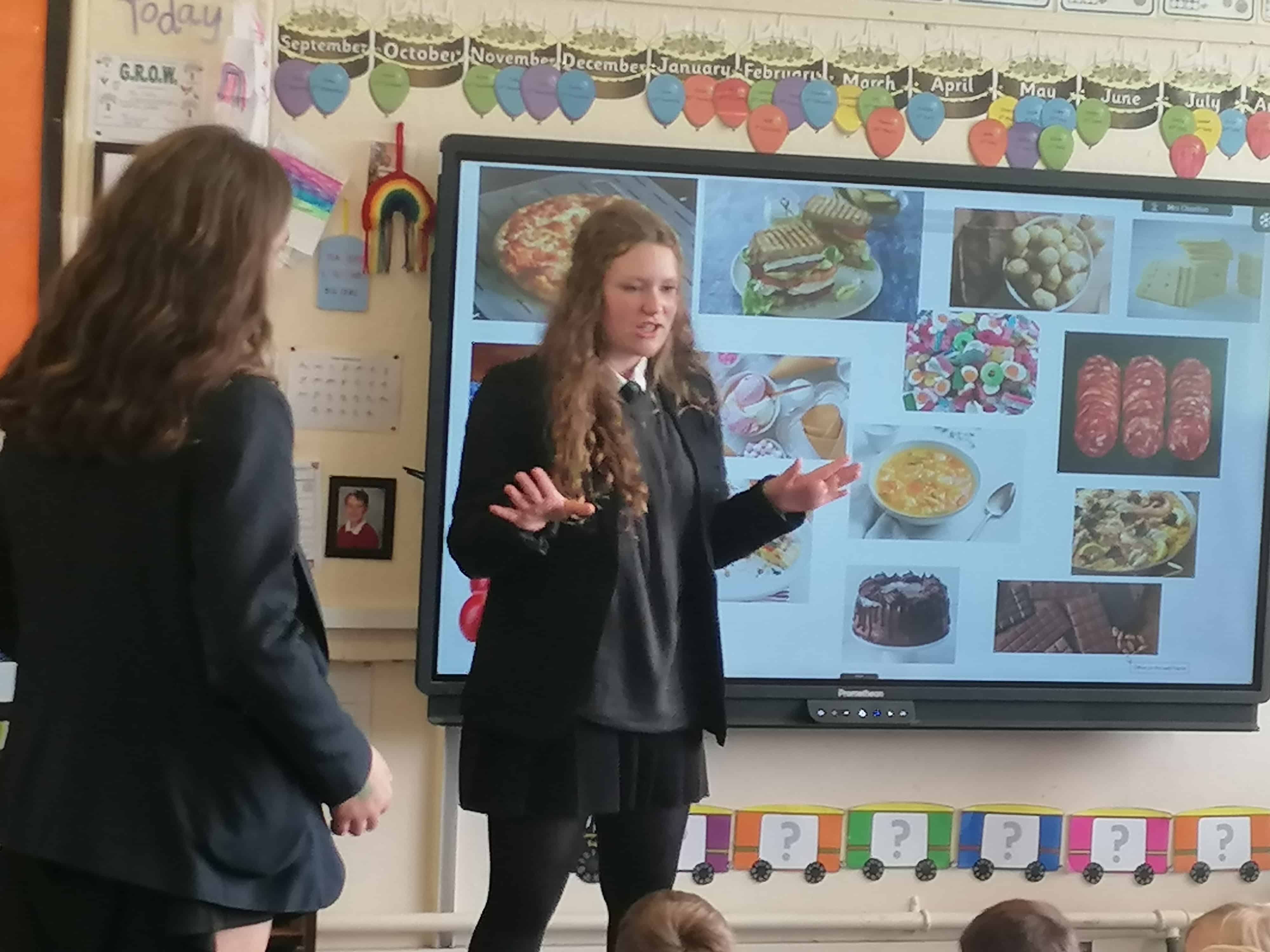 Two Languages Ambassadors from Priestnall School deliver a languages lesson to primary school pupils.