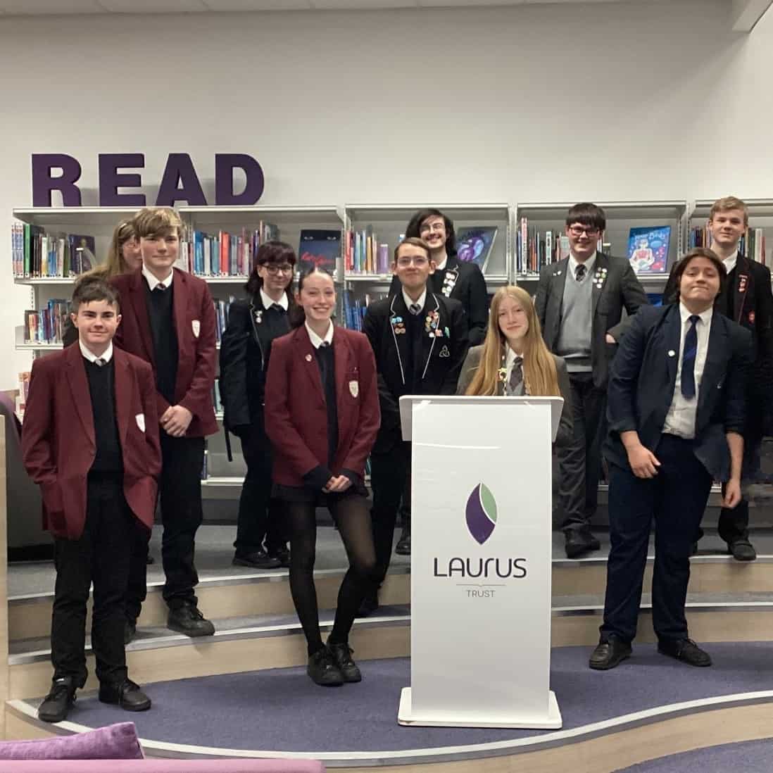 Students from Laurus Trust High Schools, including Priestnall School, stand together at the final in Laurus Cheadle Hulme.