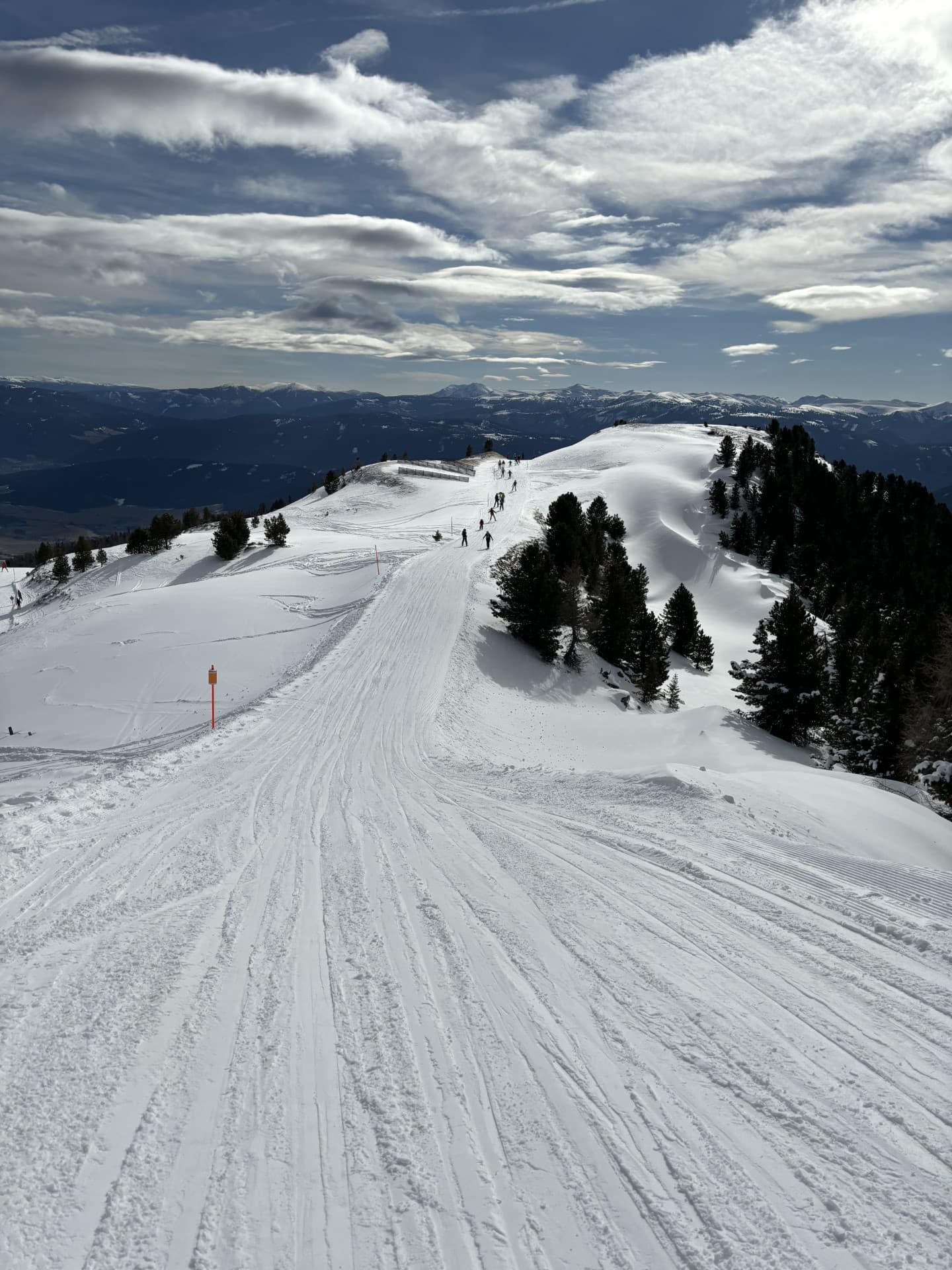 Students from Priestnall School in the distance on a ski slope in Austria.